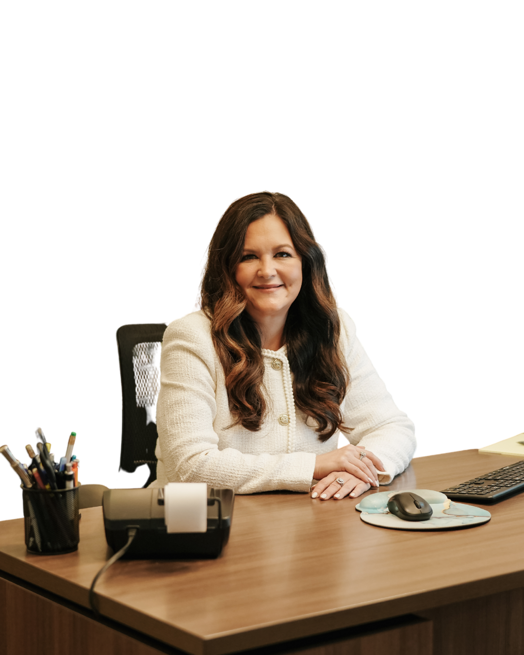 Valerie Kemp sitting at desk in office smiling
